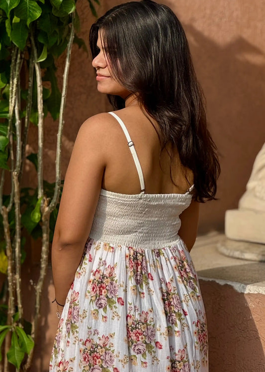 White smocked sundress with pink and purple floral print, sleeveless, soft cotton, flowy fit for women by An-Attire.