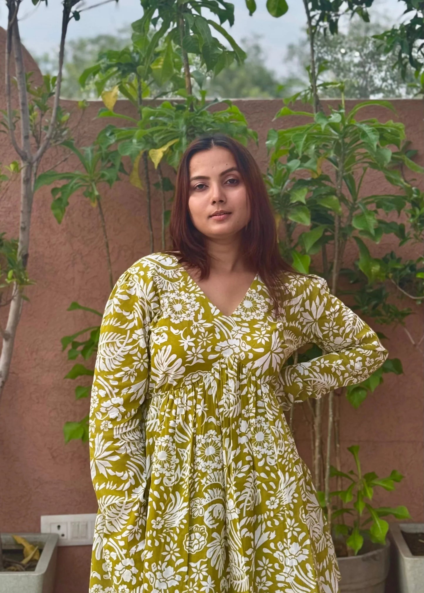 Yellow floral printed A-line dress with v-neck, full sleeves, soft cotton fabric, and elegant relaxed fit for women by An-Attire.