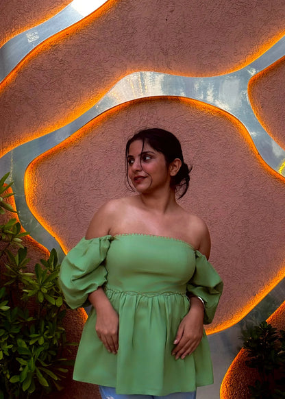 Green off-shoulder puff sleeve top with flared waist, modern feminine fit, soft fabric for women’s wear by An-Attire.