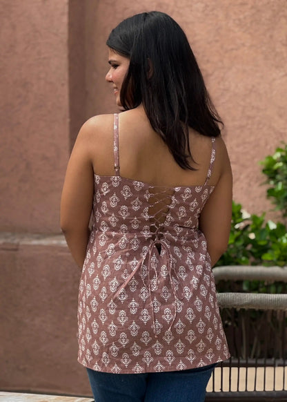 Mauve sleeveless lace-up back floral top with white motifs and relaxed fit, soft cotton women’s wear by An-Attire.