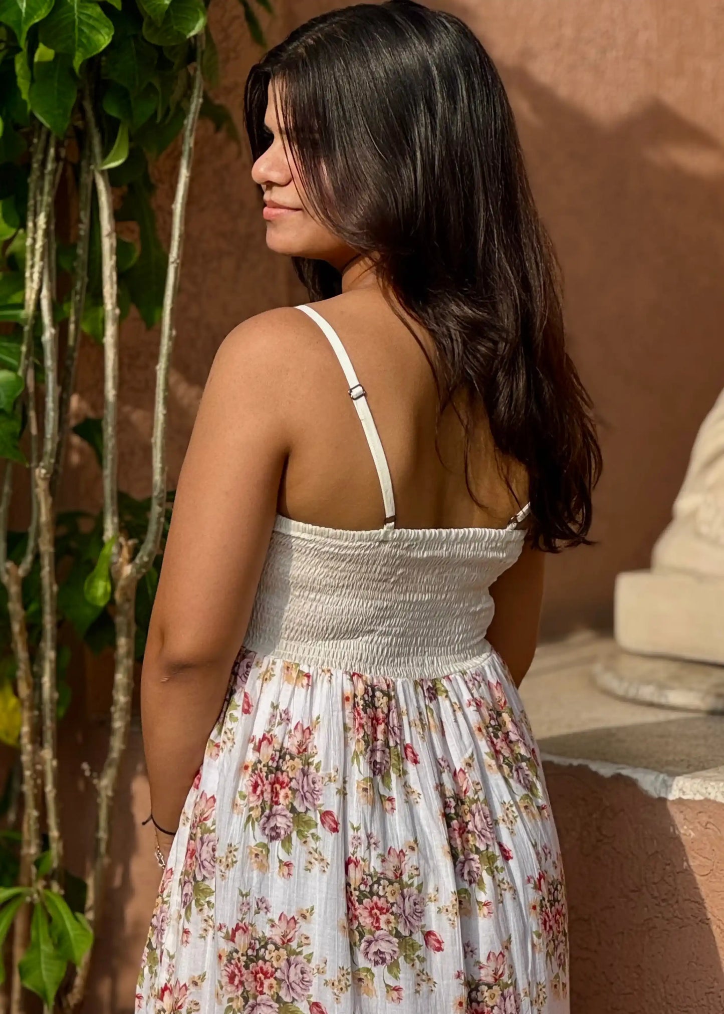 White smocked sundress with pink and purple floral print, sleeveless, soft cotton, flowy fit for women by An-Attire.