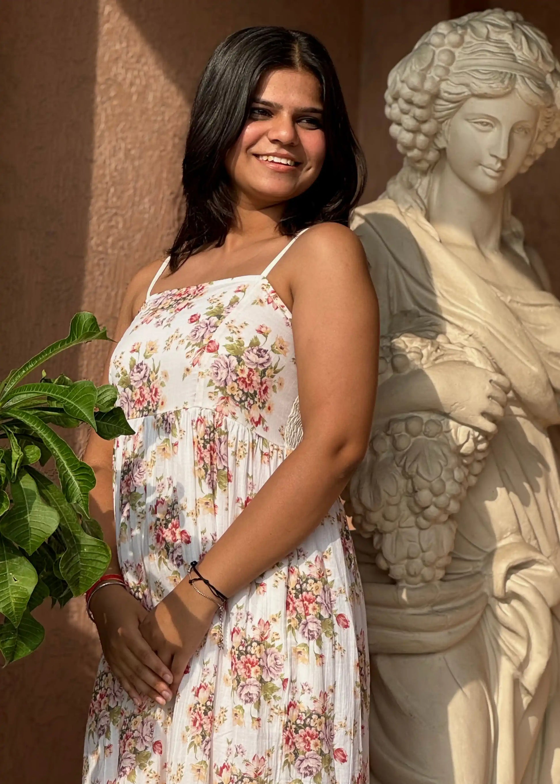 White smocked sundress with pink and purple floral print, sleeveless, soft cotton, flowy fit for women by An-Attire.