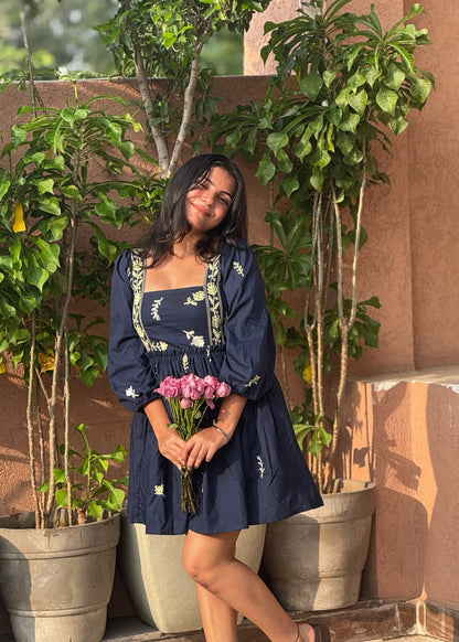 Navy embroidered floral smock dress with puff sleeves and square neckline, soft cotton, women’s elegant wear by An-Attire.