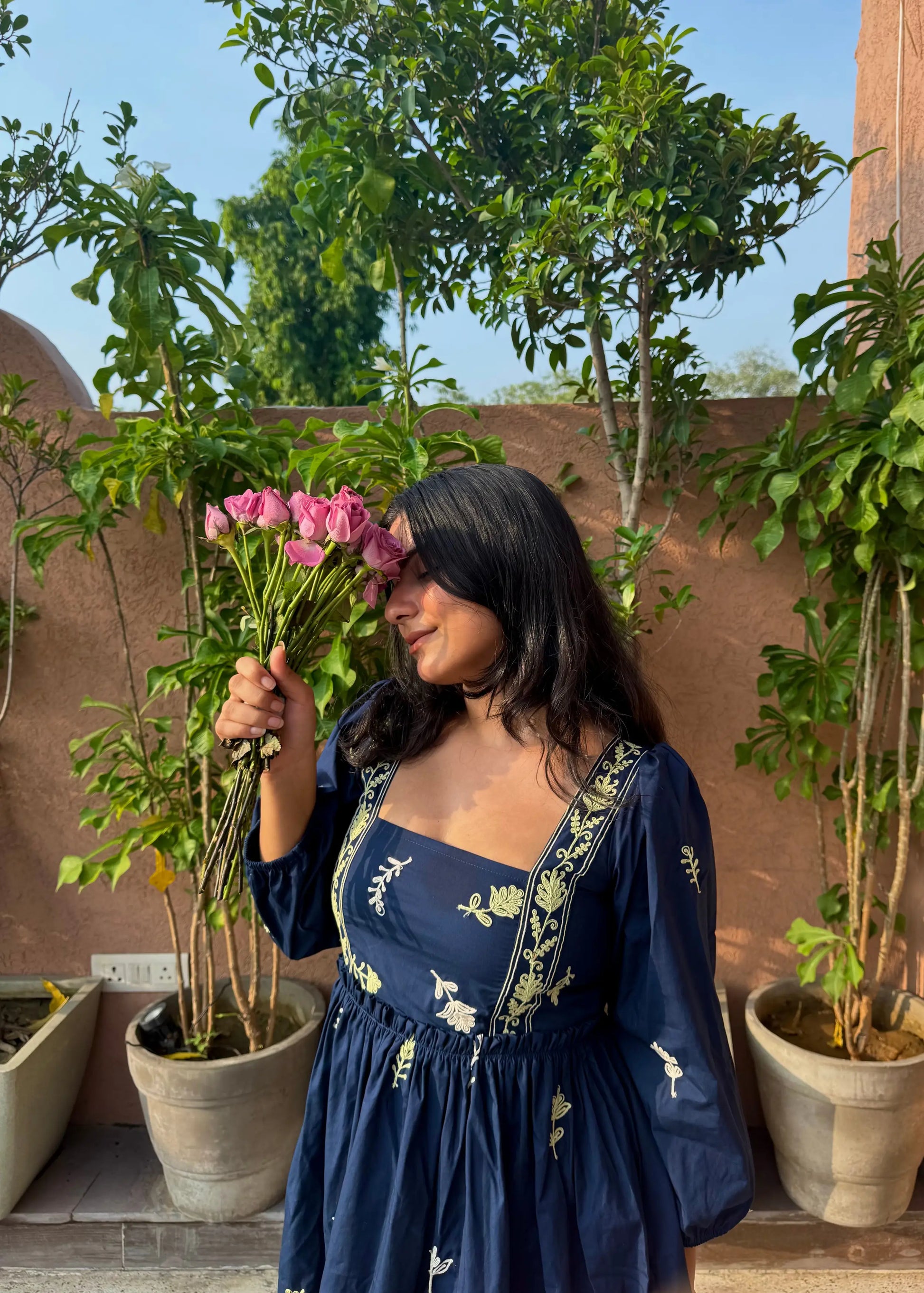 Navy embroidered floral smock dress with puff sleeves and square neckline, soft cotton, women’s elegant wear by An-Attire.