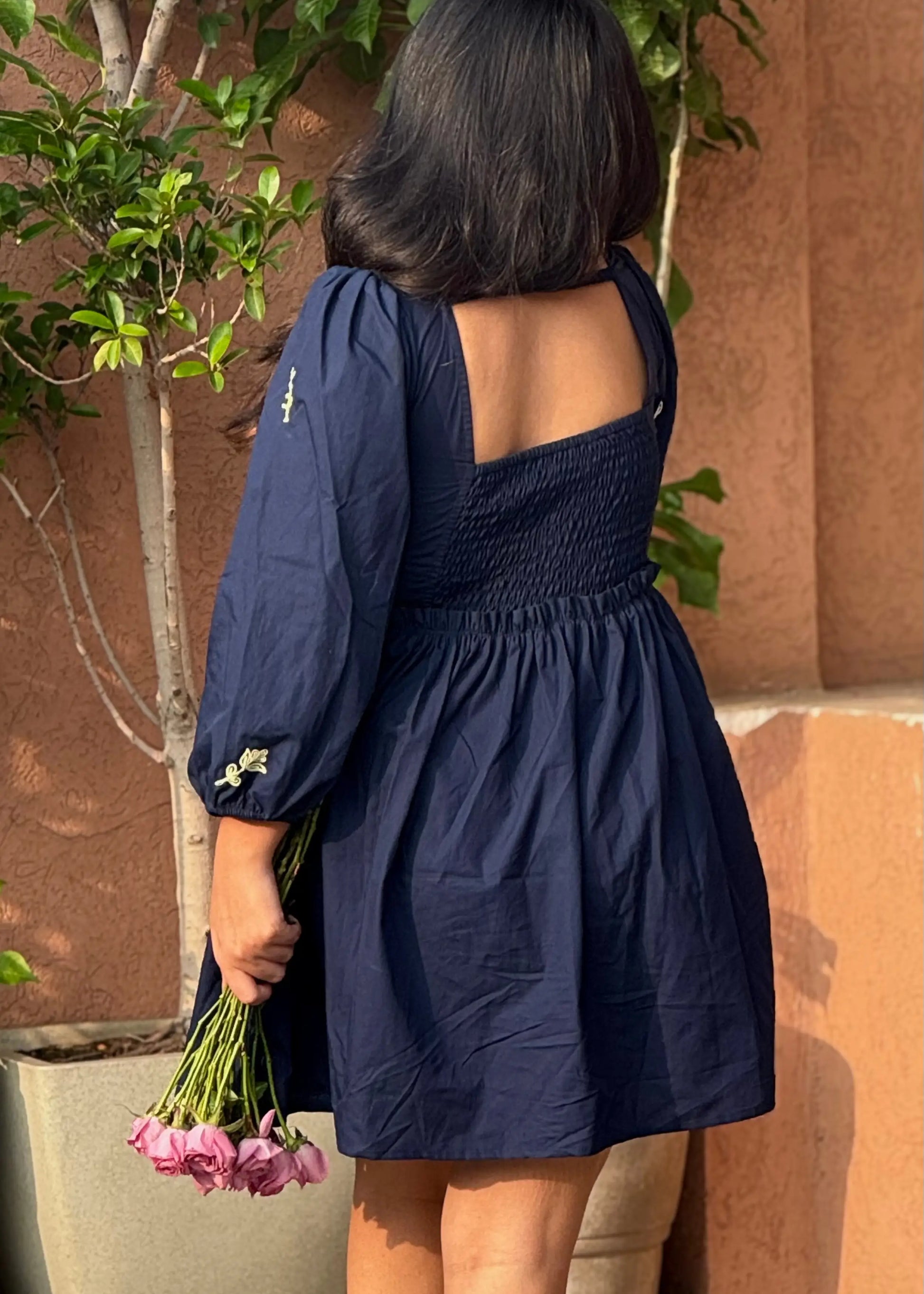 Navy embroidered floral smock dress with puff sleeves and square neckline, soft cotton, women’s elegant wear by An-Attire.