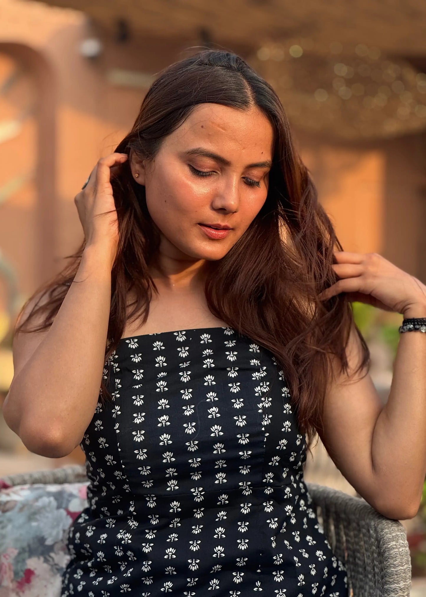 Black strapless top with white floral print, soft breathable fabric, chic fitted silhouette for women by An-Attire.