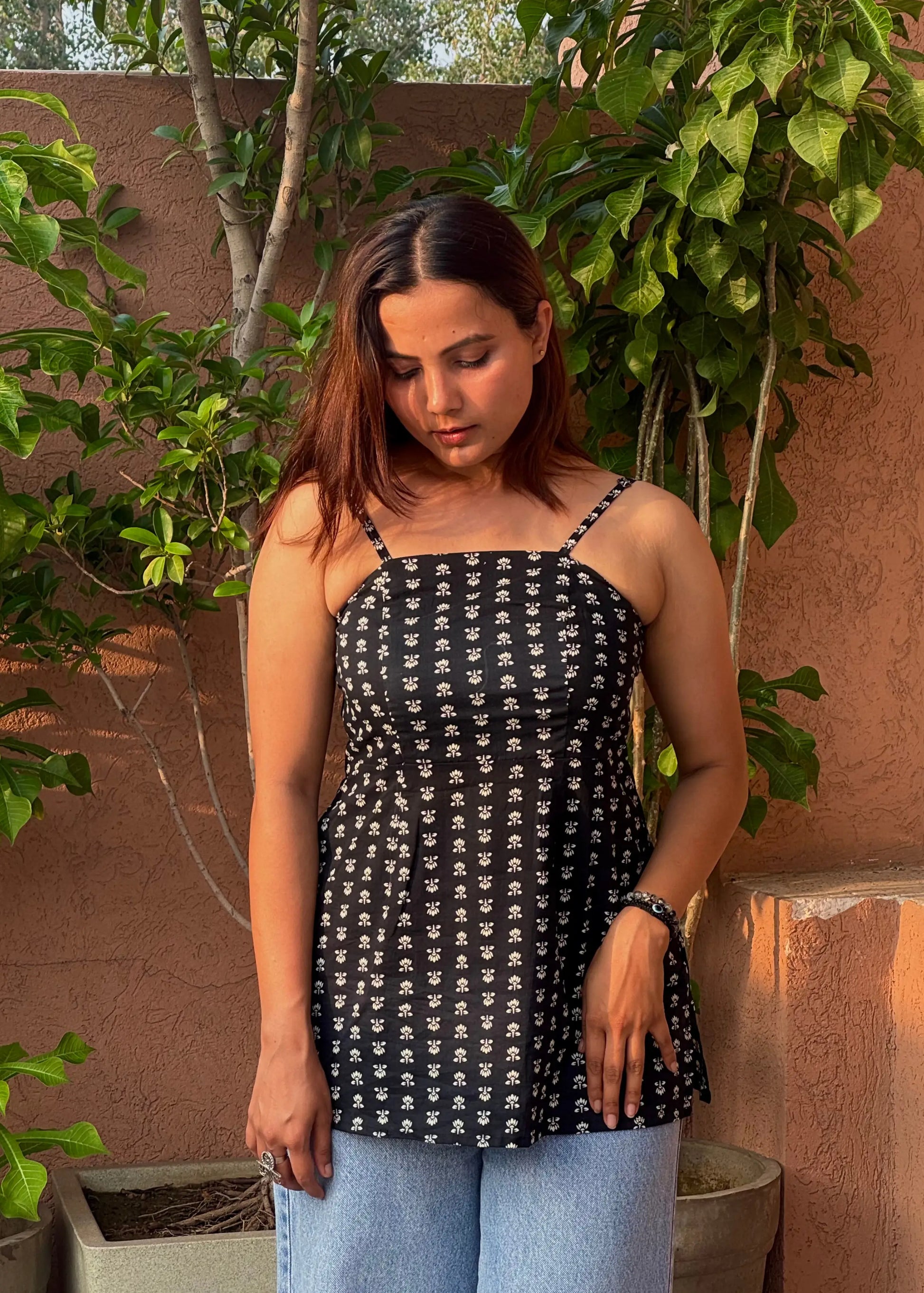 Black strapless top with white floral print, soft breathable fabric, chic fitted silhouette for women by An-Attire.