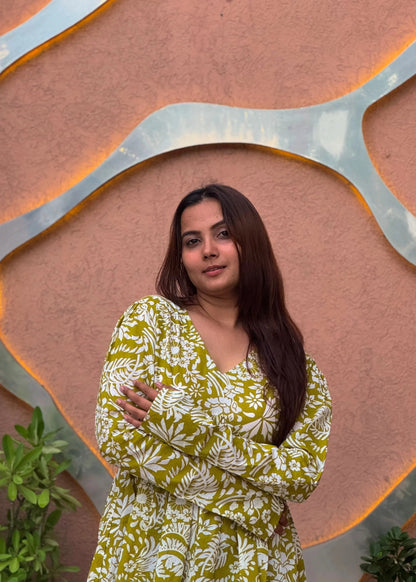 Yellow floral printed A-line dress with v-neck, full sleeves, soft cotton fabric, and elegant relaxed fit for women by An-Attire.